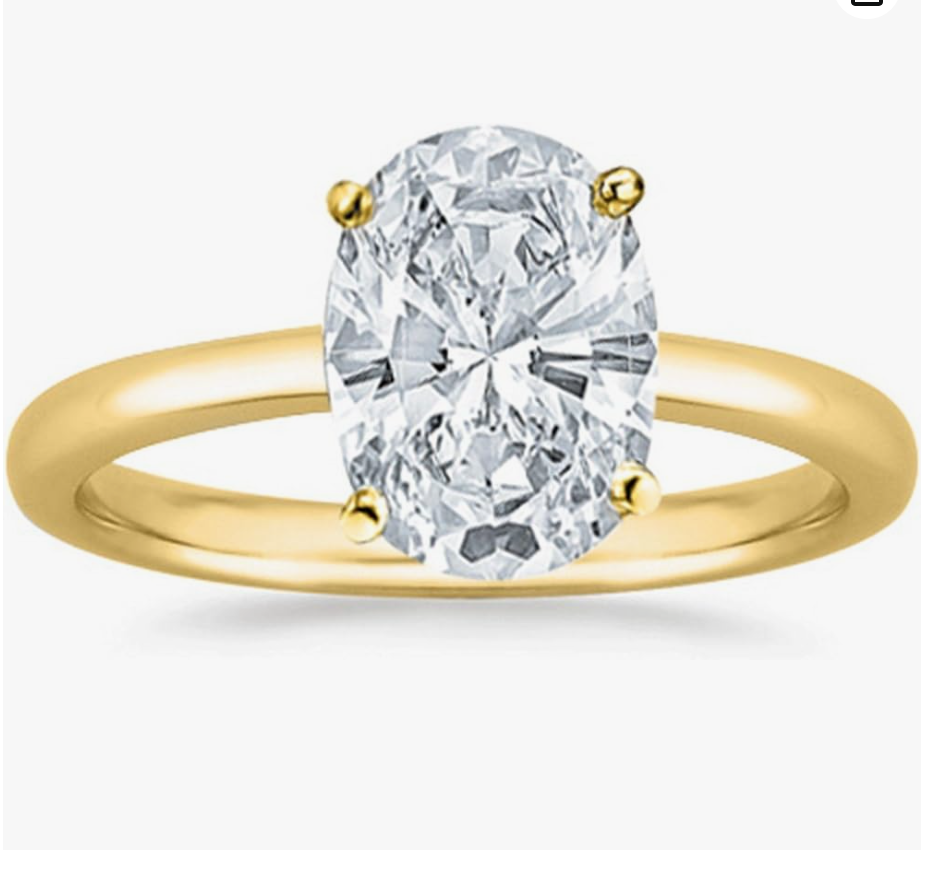 Oval cut solitaire lab-grown diamond engagement ring in yellow gold